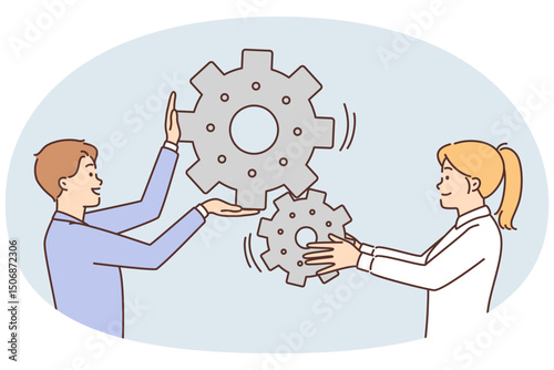 Man and woman move gears togethersymbolizing industrial business process