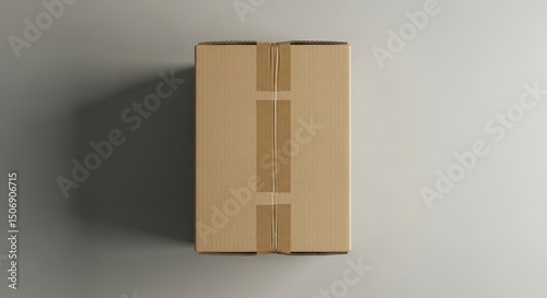 Brown cardboard box sealed with tape, top view