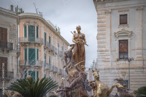 Fountain of Diana Dancing in the Rain Beneath the Grey Sky in Siracusa, Sicily, Italy