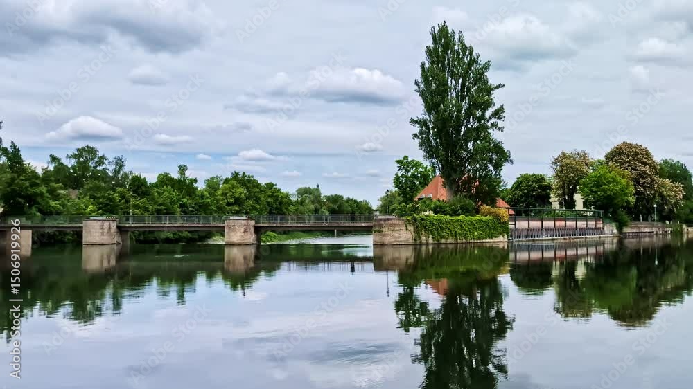 Pedestrian bridge leading to Mitterwöhr island over the Isar River in Landshut, Germany Pedestrian bridge leading to Mitterwöhr island over the Isar River in Landshut, Germany