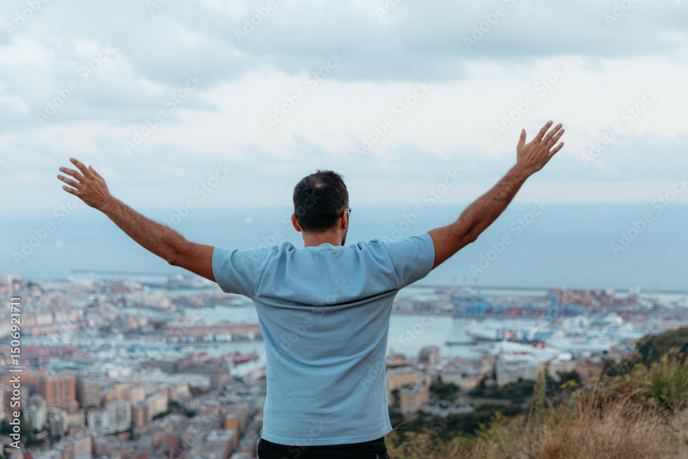 Tourist enjoying genova cityscape and harbor from a scenic viewpoint with open arms Tourist enjoying genova cityscape and harbor from a scenic viewpoint with open arms