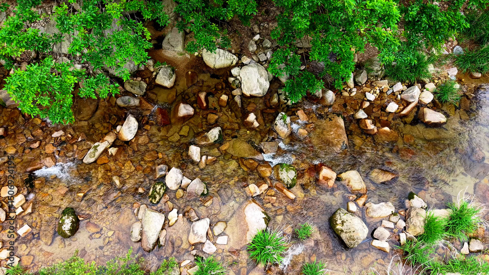 Obraz premium Aerial Drone Footage of a Clear Mountain Stream Flowing Through Mungyeong Countryside in Late Spring and Early Summer, Korea