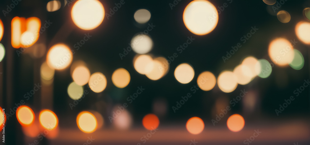 Obraz premium Blurred lights create a bokeh effect against a dark background abstract and festive.