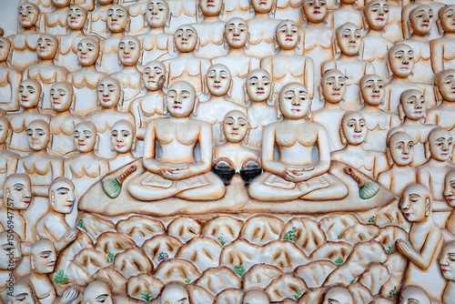 Preaching of Jain religion etched in marble stone with colorful intricate carvings outside a Jain temple in Shravanabelagola, India. photo