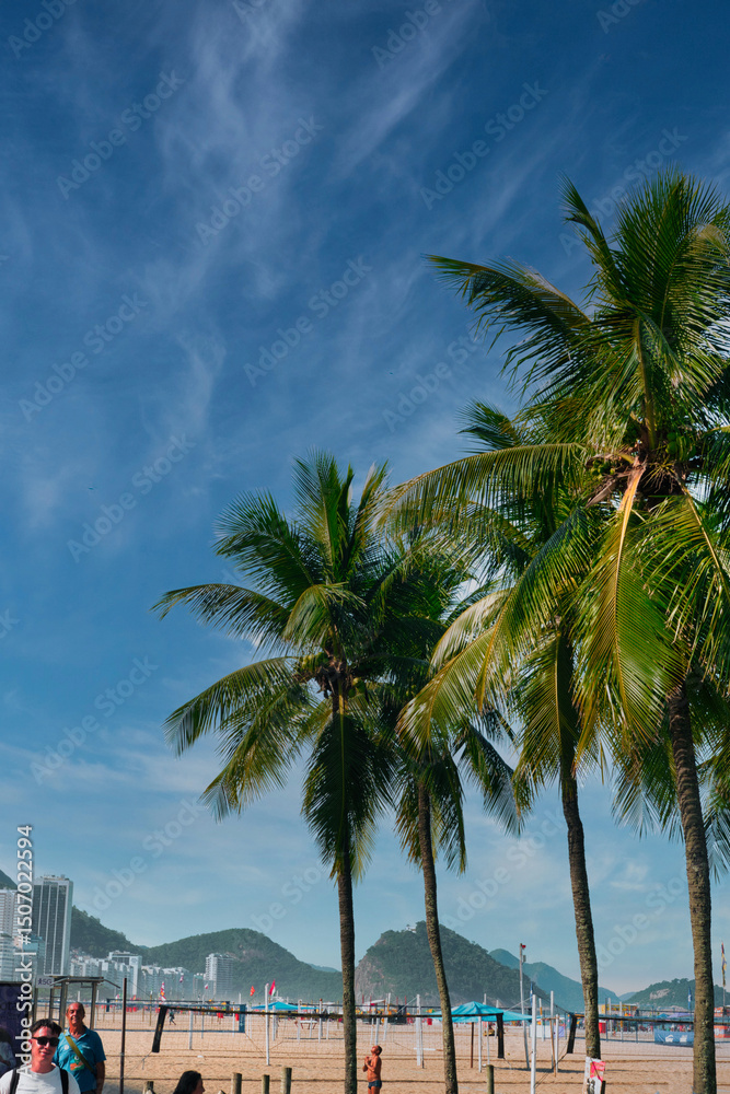 Fototapeta premium Rio de Janeiro, Brazil, May 19, 2025: Copacabana Beach is a beach located in the Copacabana neighborhood, in the South Zone of the city of Rio de Janeiro, Brazil. Beautiful blue skies and golden sand