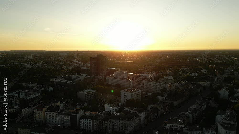 Sunset Silhouette Over Eimsbuttel Skyline and the drone moving toward the sun in Hamburg, Germany Sunset Silhouette Over Eimsbuttel Skyline and the drone moving toward the sun in Hamburg, Germany