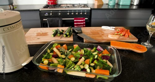 Preparing fresh vegetables in modern kitchen with wine and olive oil, at home