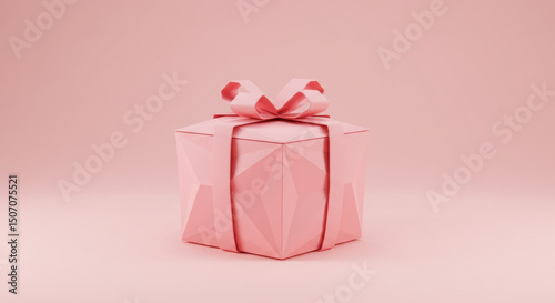 Colorful pink origami gift box with a bow on a pastel background creating a playful atmosphere for celebrations
