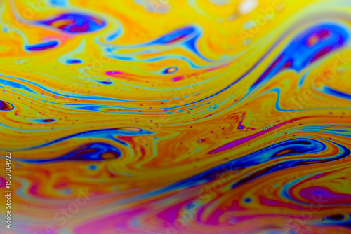 Vivid swirling colors on soap film macro textures