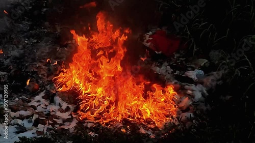burning fire on rubbish pile