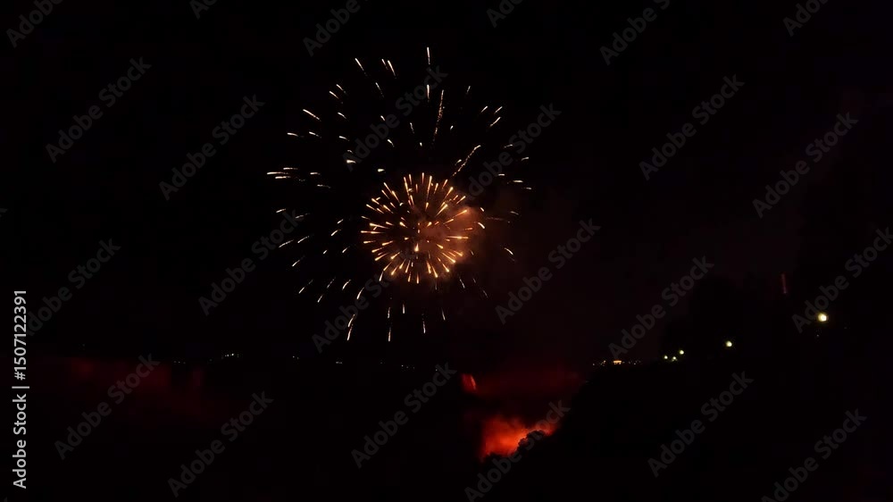 Dazzling burst of red fireworks lighting up the dark sky during a festive night celebration Bright explosion of red fireworks lighting up the dark sky during festivities