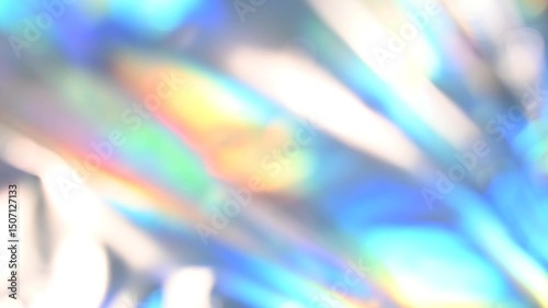 Shiny holographic foil with colorful reflections creates a and vibrant captivating rainbow background video 4k