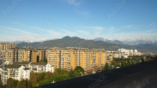 The image captures the striking contrast between urban development and natural scenery in western China 
Chengdu, Sichuan 
