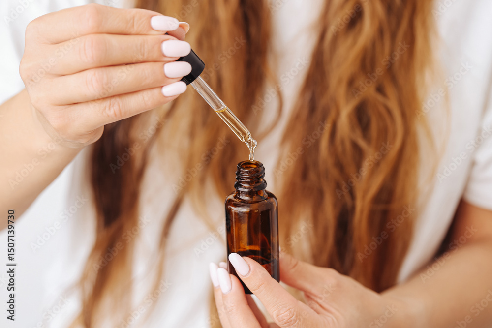 custom made wallpaper toronto digitalWoman using cosmetic serum. Pipette with skincare oil. Natural beauty routine. Argan oil treatment. Female hands holding dropper bottle. Daily face care. Moisturizing essence for skin glow.