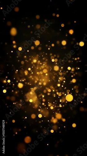 Golden particles floating softly against a dark background creating a magical ambiance