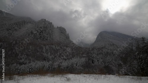 Clouded Peaks and Frosted Trees in Bipenggou National Park, China on January, winter season 