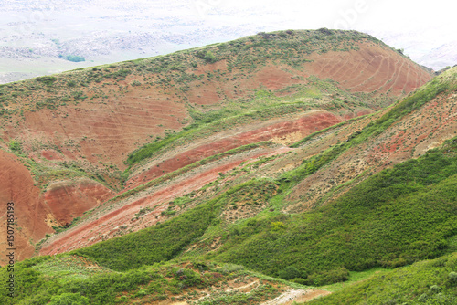 Colorful spectacular panoramic view of rainbow mountains hills in Georgia. Striped desert of Mravaltskaro mountains at the border of Georgia and Azerbaijan. Famous tourist place