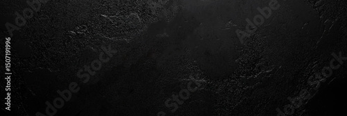 Dark gray black slate stone background or texture, horizontal shape with space for design. Web banner. Wide. Panoramic.