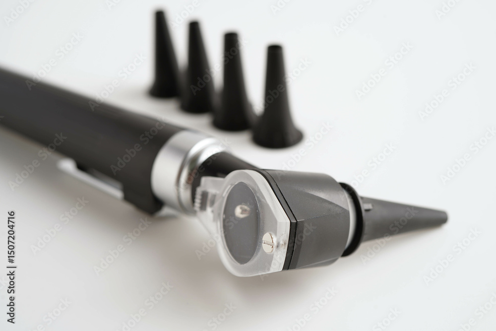 Otoscope isolated on white background for otolaryngologist or ENT physician doctor examining senior patient ear, hearing loss problem. Otoscope isolated on white background for otolaryngologist or ENT physician doctor examining senior patient ear, hearing loss problem.