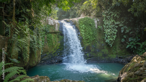 Lush waterfall cascading into a turquoise pool surrounded by verdant green jungle foliage