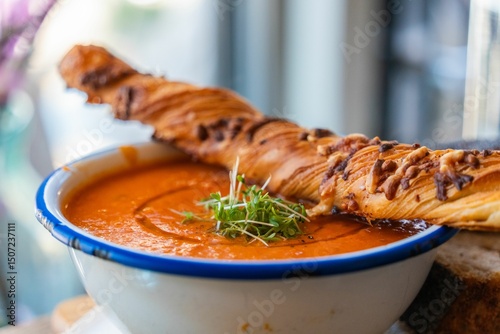 Tomato soup with herbs and breadstick