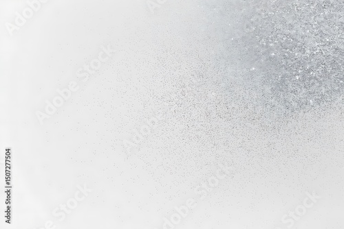 Elegant silver glitter explosion on a clean, white background for artistic design