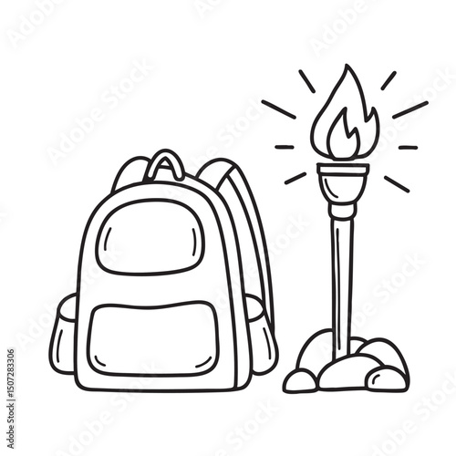 A torch resting on rock beside a backpack on the ground