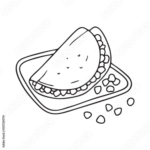 A tortilla beside scattered corn kernels on a tray