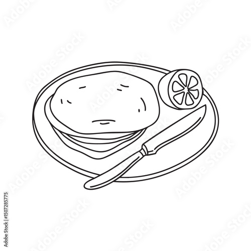A tortilla on plate beside a knife and lemon wedge
