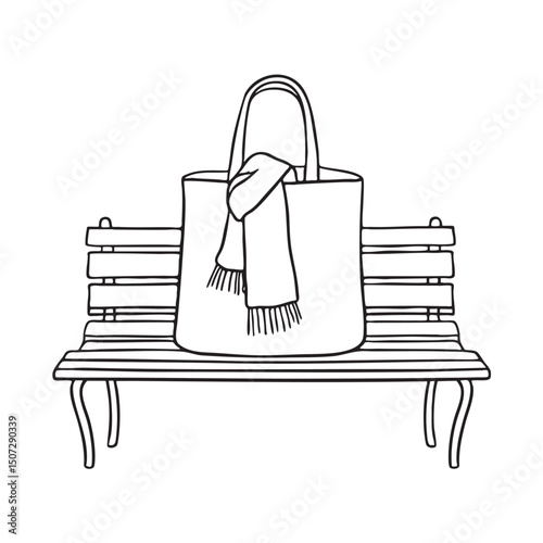 A tote bag with a scarf peeking out on bench