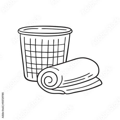A towel rolled up near an empty laundry basket
