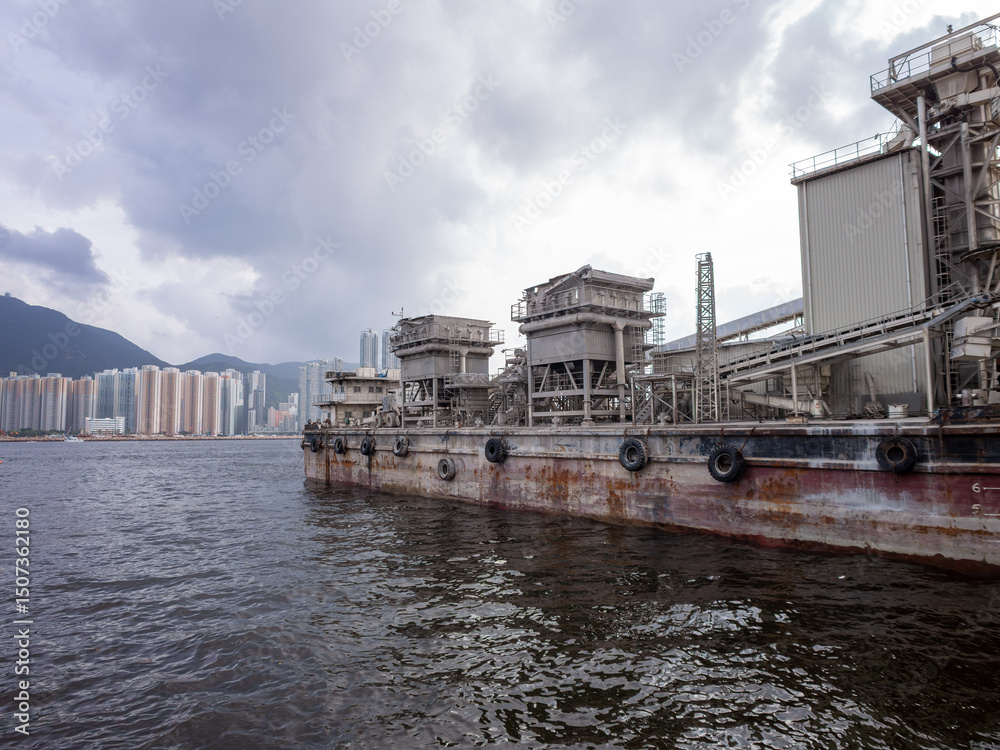 Fototapeta premium Industrial Dockside with Cityscape