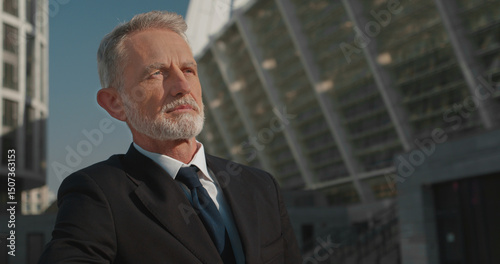 Wallpaper Mural Experienced company director standing outdoors near office building, leadership, success Torontodigital.ca