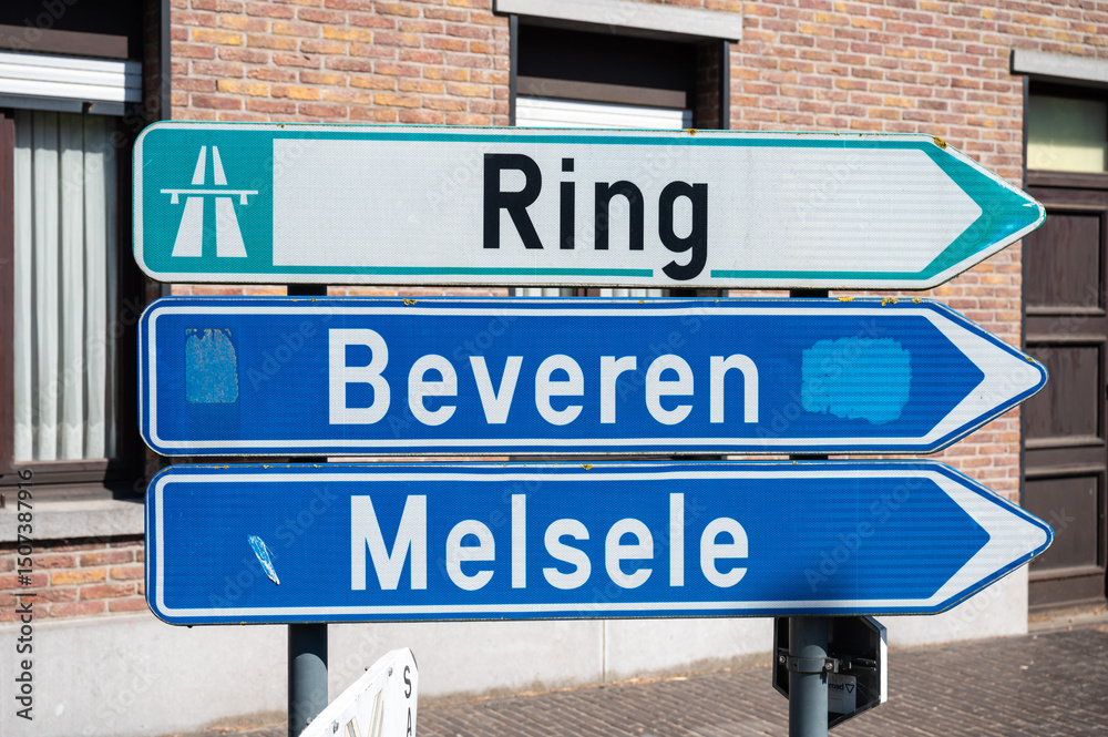 Obraz premium Road sign to the ring of Antwerp and the cities of Melsele and Beveren in Kallo, East Flanders, Belgium