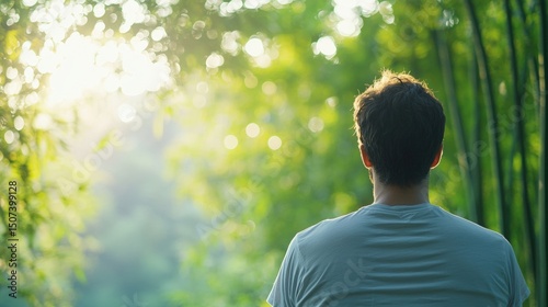 Serene man contemplating natures tranquility in bamboo forest