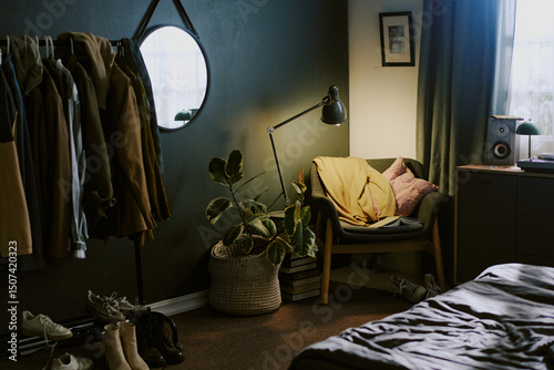 Photography Cozy bedroom featuring organized space with mirror, potted plant, reading lamp,