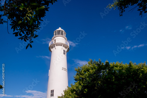 Blue sky and navy lighthouse on Ilha do Mel, Paraná, Brazil