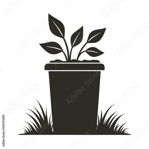 Plant with green leaves in waste container