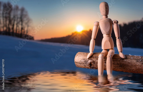 A wooden mannequin sits quietly by a melting lake at sunset, its reflection mirrored in the still water, evoking solitude and contemplation in a winter landscape...