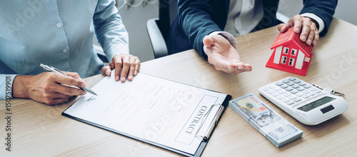 Real estate broker agent consulting the customer to a decision making sign insurance form agreement contract