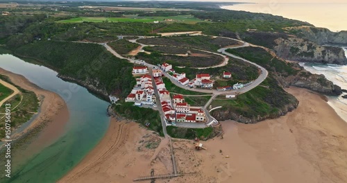 Aerial view of small village with windmill and picturesque rooftops, Odeceixe, Portugal