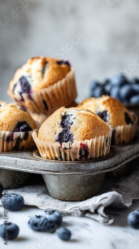 Freshly Baked Blueberry Muffins on a Rustic Tray With Blueberries