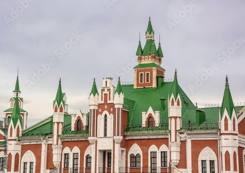 Tiled roof and Gothic towers of pseudo-Gothic architecture