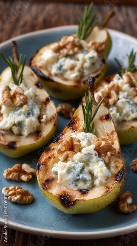 Grilled Pear Halves Topped With Blue Cheese and Walnuts Served on a Blue Plate