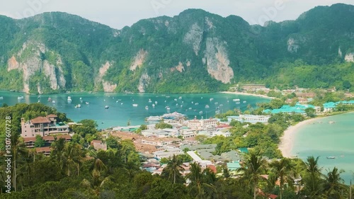 Aerial view of tropical island Phi Phi Don with luxury resorts and yachts in bay of Andaman sea, Krabi, Thailand. Popular touristic vacation holiday destination in Asia
