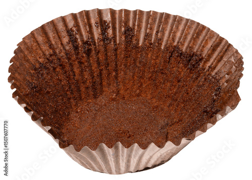 Photography Close up of empty brown paper cupcake or muffin tin with chocolate residue, isol