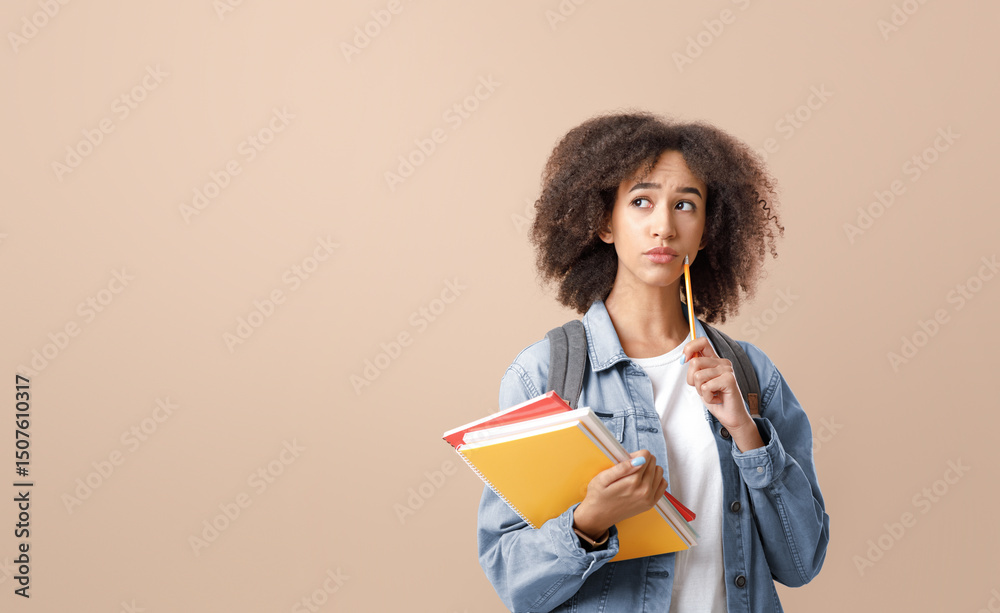 Fototapeta premium Serious question and making decision studying after quarantine. Pensive african american lady with smart watch holds notepads and press pencil to cheek and looks at free space, on light background