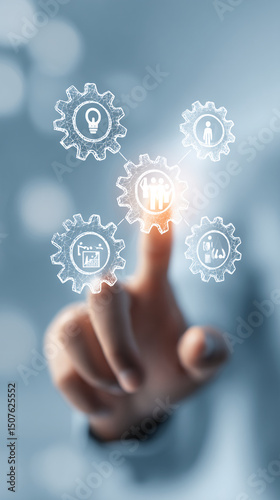 Hand selecting innovative business concepts through digital gears in a modern workspace
