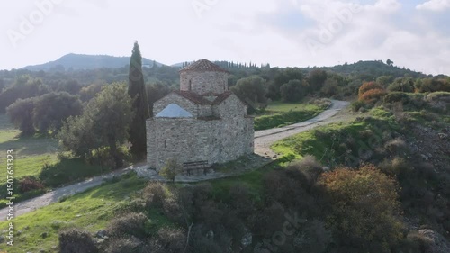 Scenic view of the historic Panagia Livadiotissa Chapel nestled in the serene landscape near Pano Lefkara, Cyprus, showcasing its timeless beauty and tranquil surroundings