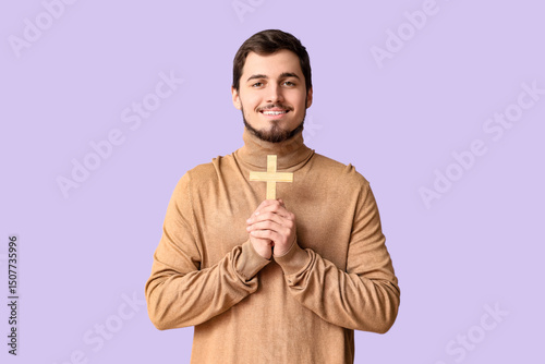 Smiling man with wooden cro...